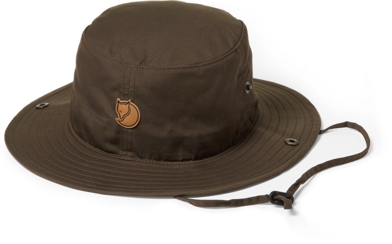 Wide brim sun protection hat on a hiker in the mountains, offering shade and style
