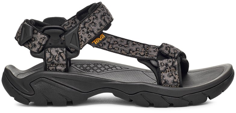 Close-up of men's rugged outdoor sandals showing durable webbing and traction sole