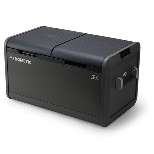 Dometic CFX5 75 portable fridge freezer standing open, showcasing its dual cooling zones and interior light, perfect for organizing food on camping trips.