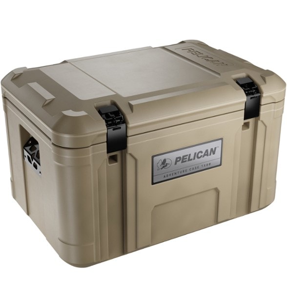 Pelican TX80 Trailblazer hard case securely strapped to a roof rack, ready for an outdoor adventure, showcasing its large waterproof storage for outdoor equipment.