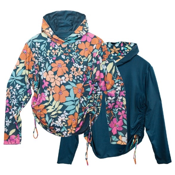 Reversible sunshade showcasing two vibrant patterns for women at the beach