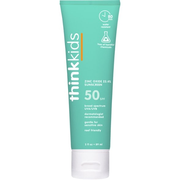 Thinksport Kids SPF 50 sunscreen bottle outdoors during playtime