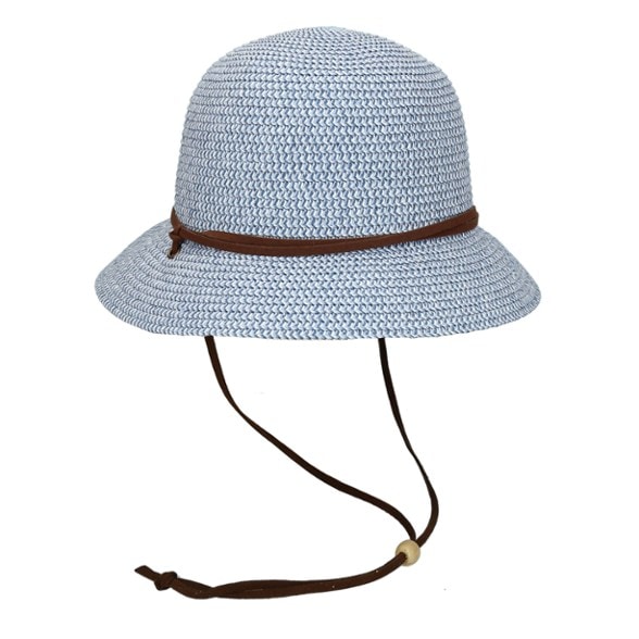 Side view of the Aelia crushable cloche hat on a sunny beach, demonstrating UV protection technology.