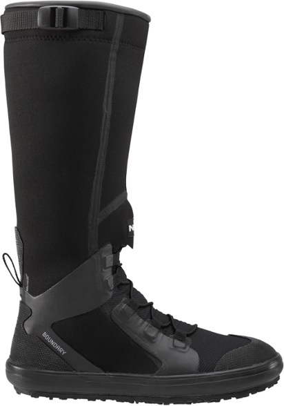 Men’s Boundary neoprene paddling boots on rocky shoreline, showcasing grippy soles