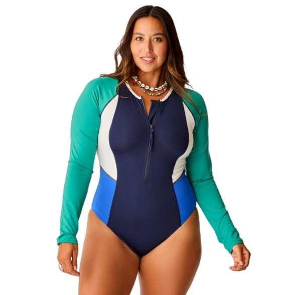 Seaview long sleeve swimsuit modeled by a woman at the beach