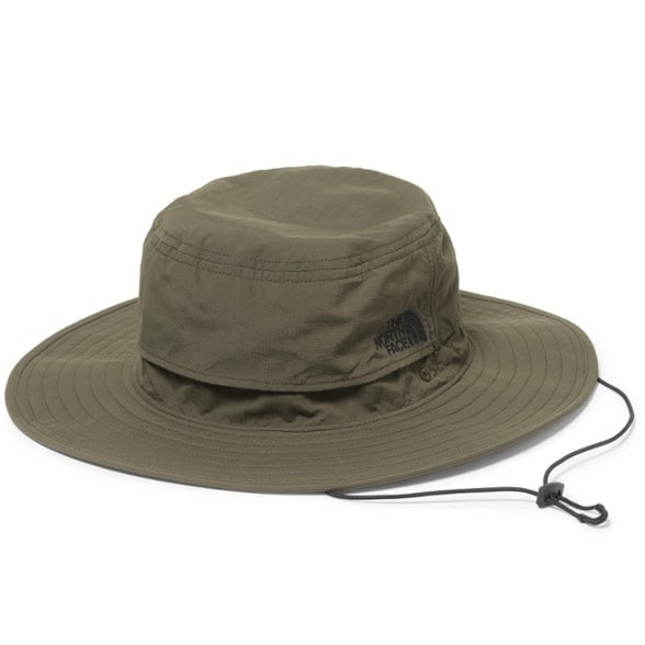 The North Face Breeze Brimmer hat worn by a man on a sunny day, showcasing its sun protection features.