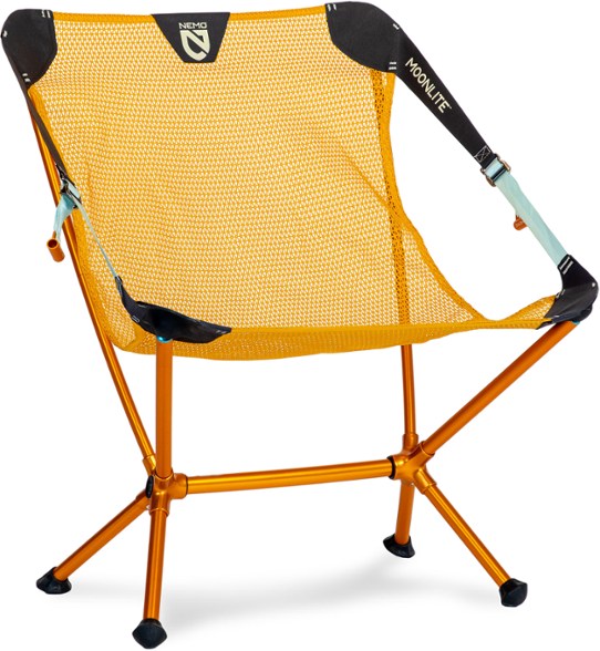 NEMO Moonlite camping chair set up at a picnic site, showcasing its lightweight design and mesh seat.