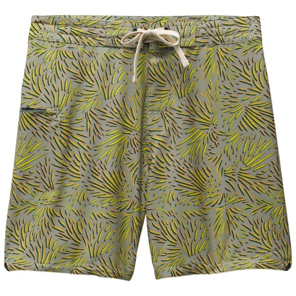 A man in Horizon Quick-Dry UPF 50+ Surf Board Shorts standing on a sunny beach, looking out at the ocean, showcasing the stylish design.