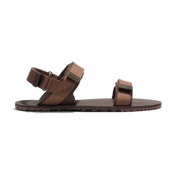Xero Shoes D-Trail sandals side view on rocky trail, showcasing tread pattern