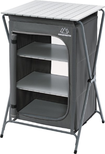 Front angle of SummitCraft camp pantry set up beside a grill in outdoor kitchen setting