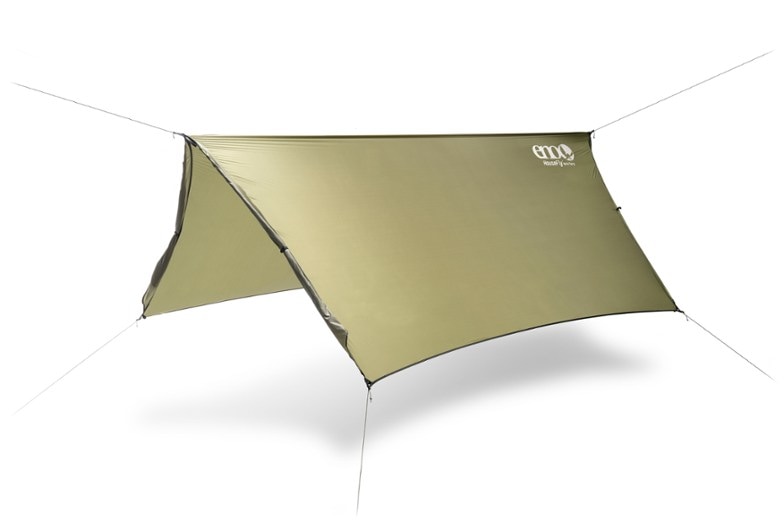 Top view of SkyFort Elite tarp stretched above hammock in wet forest — shows waterproof tarp performance.