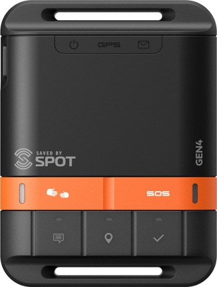 SPOT Gen4 satellite messenger in outdoor setting with rugged terrain