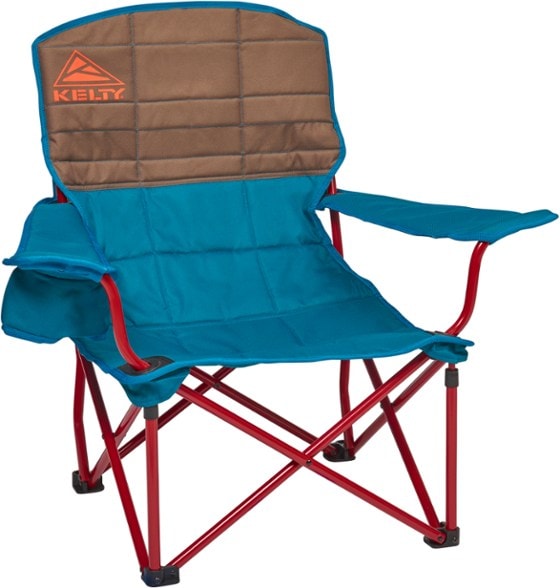 ChillOut camping chair set up by the campfire, showcasing its adjustable features and cup holder.