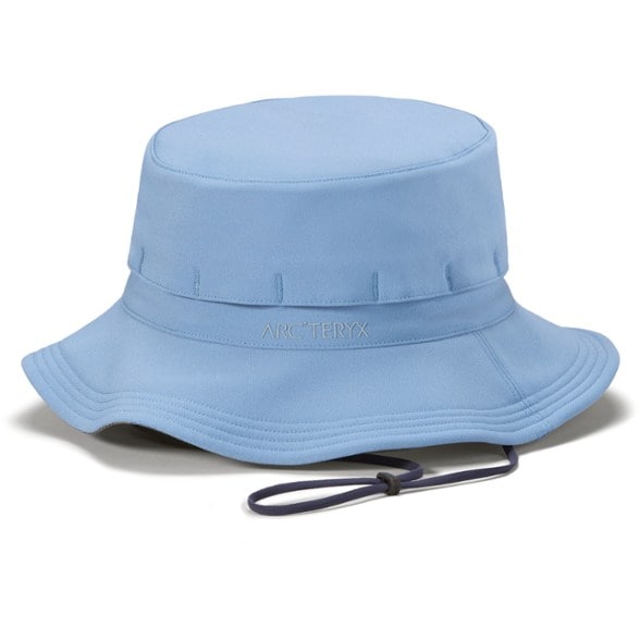 Side view of the Arc'teryx Bora wide brim hat in a natural setting, highlighting its ventilated design.