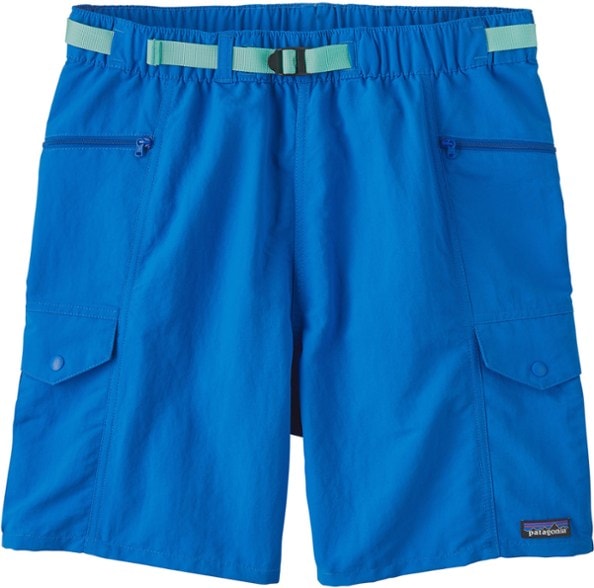 Men wearing waterproof shorts surfing with cargo pockets visible