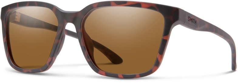 Eco-Luxe polarized sunglasses displayed in a natural setting with trees in the background.