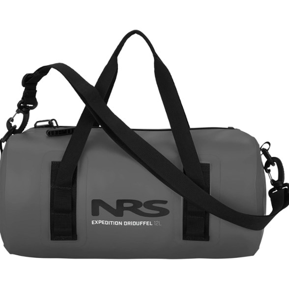 Waterproof duffel bag floating beside kayak during river trip