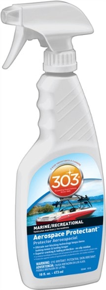 Close-up of 303 aerospace protectant bottle next to marine gear, highlighting UV defense.