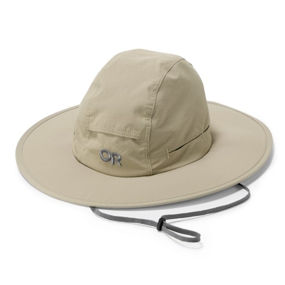A person wearing the HorizonSeeker wide brim sun hat, looking out over a scenic hiking trail with mountains in the background, showcasing its UPF 50+ protection.