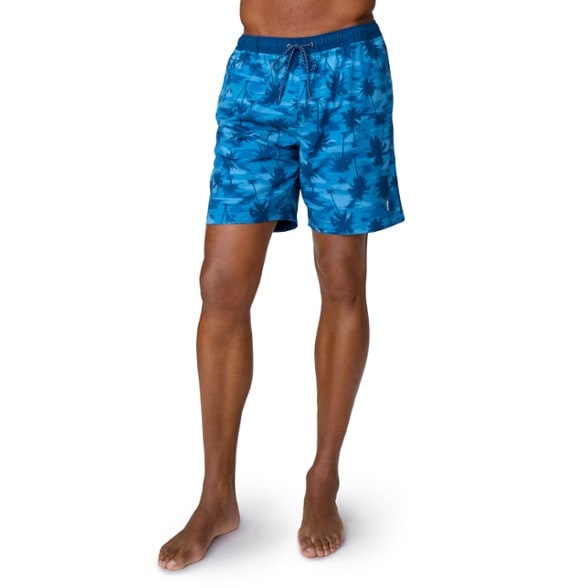Men's swim shorts showcasing the elastic waist and quick-drying fabric, ideal for beach outings.