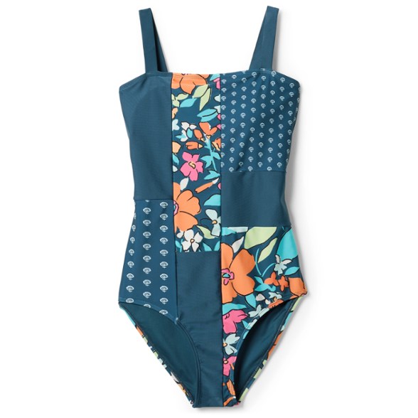 Front view of patchwork one-piece swimsuit on a model at the beach