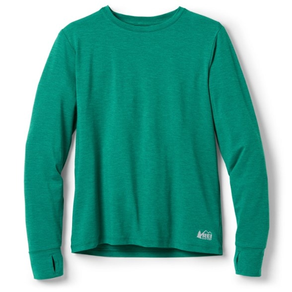 Child wearing UPF 50 kids' long-sleeve hiking shirt on trail