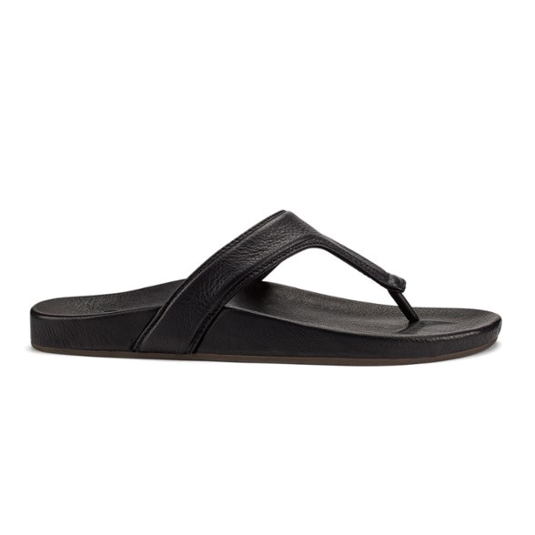 OluKai Kipe'a Lipi leather flip flops in tan, showing the Vario Strap design from a side angle