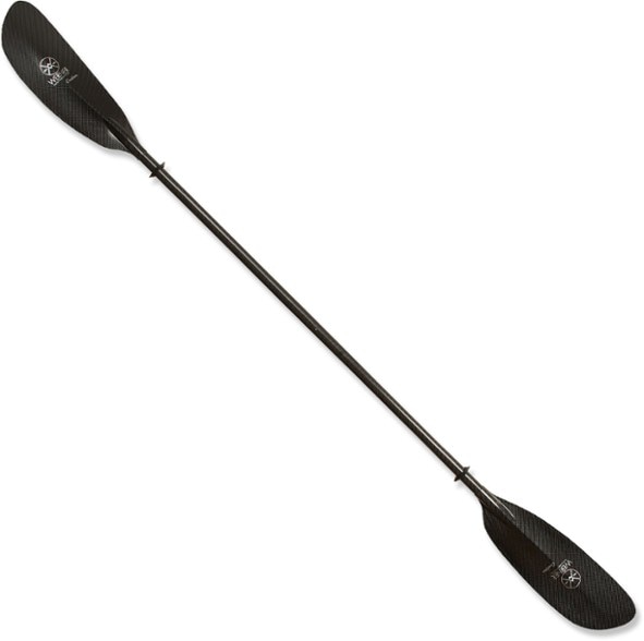 Ovation carbon performance kayak paddle shown in action on a serene lake.