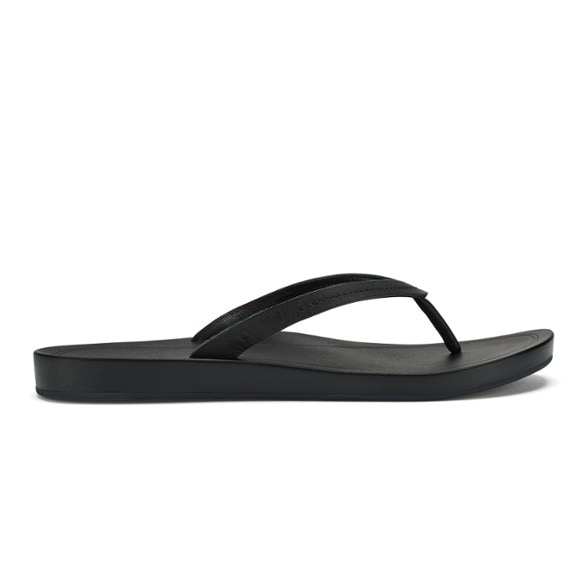 Side view of women's flip-flops showing sleek leather straps and open-toe design.