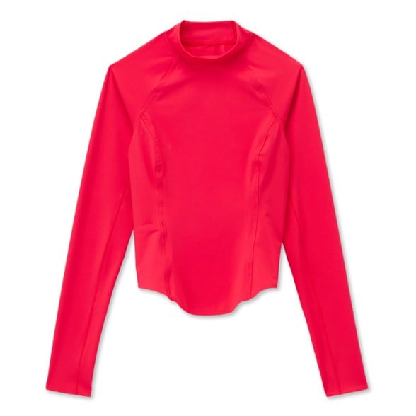 Front view of women's rashguard showing side pocket detail and long sleeves for UPF protection