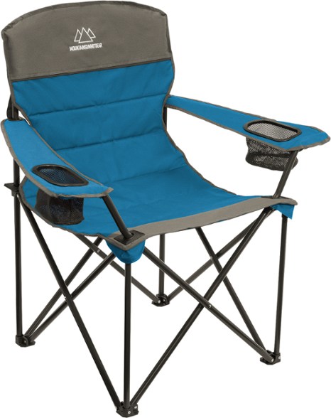 Front view of SummitEase quilted camp chair set up beside a tent