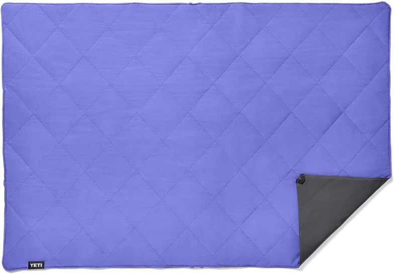 Folded TrailHaven camping blanket showing waterproof layer in charcoal gray.