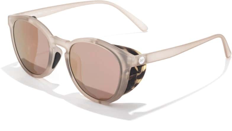 Sunski Tera polarized sunglasses on a rocky mountain path, highlighting their side shields and eco-friendly design.