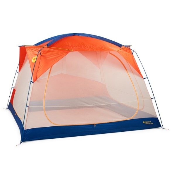 Marmot Limestone Lanai screen house tent set up at a campsite, showing one of its large zippered doors open, with a picnic table inside.