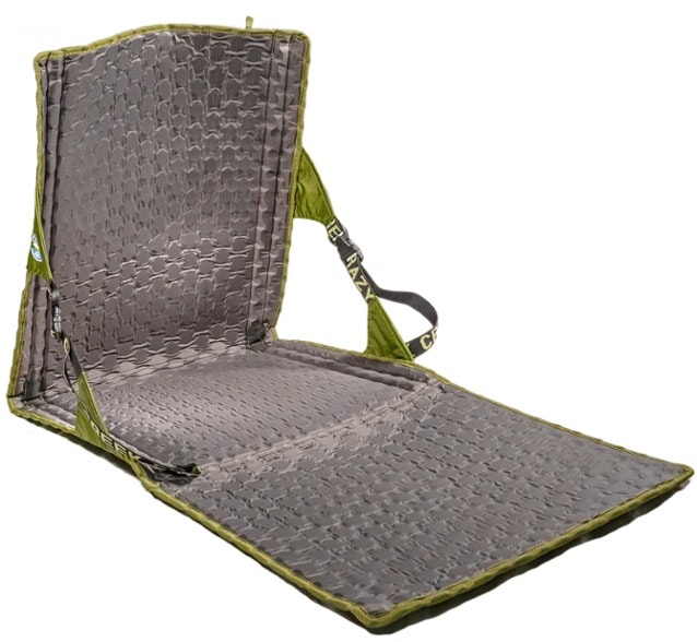 Hex 2.0 Power Lounger chair in a campsite setting, demonstrating its lightweight features.