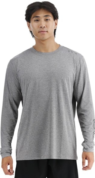 Front view of men's UPF 50 shirt with long sleeves worn during a mountain hike