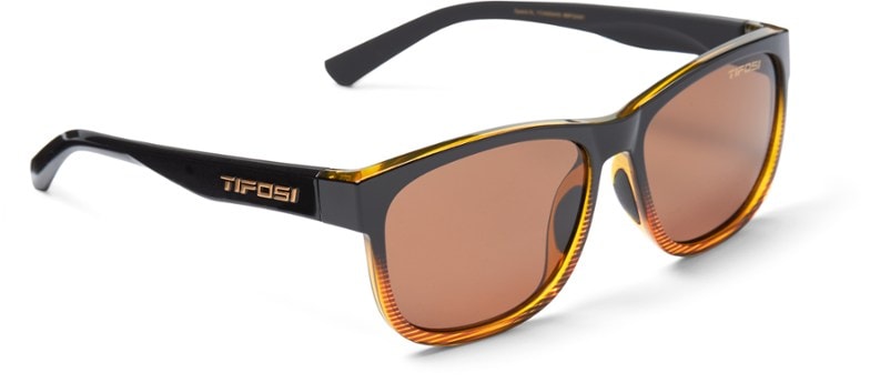 Tifosi Swank XL polarized sunglasses on a hiker's face with mountain background