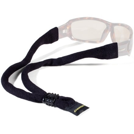 A close-up shot of a cotton glasses strap for men, showcasing the braided texture and adjustable bead against a blurred outdoor background, emphasizing durability and comfort.