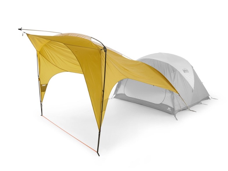 REI Base Camp Auto-Connect Shelter attached to an SUV and REI Base Camp tent, offering a spacious covered area for a family camping.