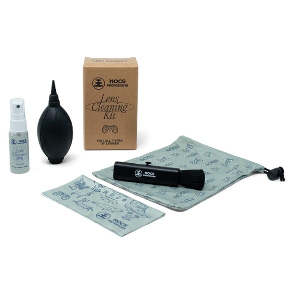 Top-down view of full lens cleaning kit spread out on a table with pouch included