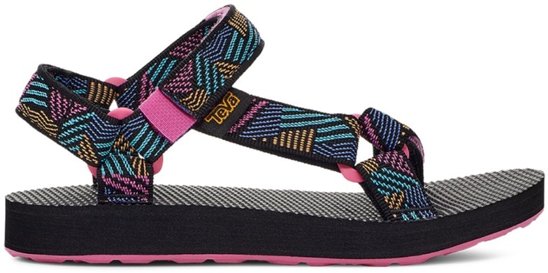 A child's foot wearing a blue Trailblazer Aqua-Adventure Sandal, showcasing the adjustable straps and sturdy sole on a rocky path.