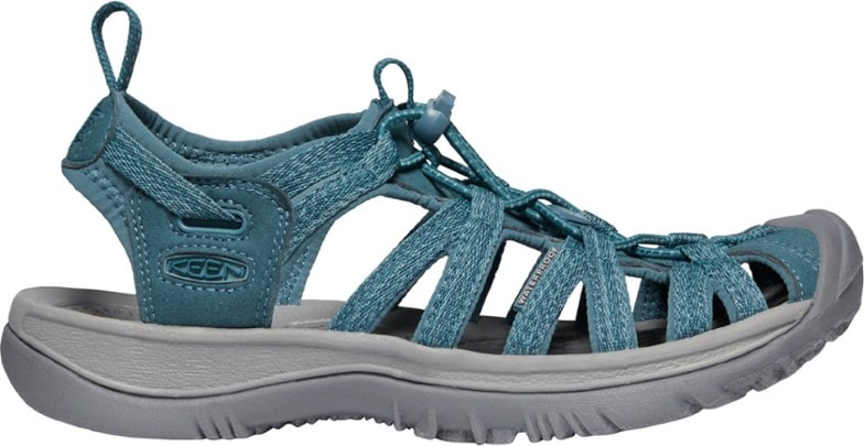 Side profile of KEEN Whisper women's performance sandals in a vibrant blue color, showcasing the bungee lacing system and protective toe cap.