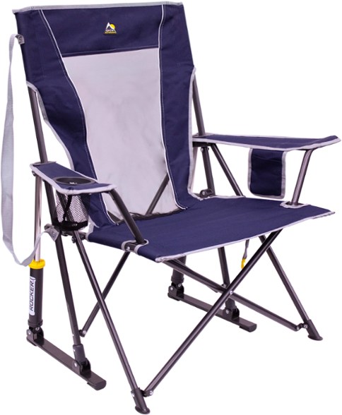 GCI Comfort Pro Rocker chair in a serene outdoor setting, showcasing its smooth rocking feature.