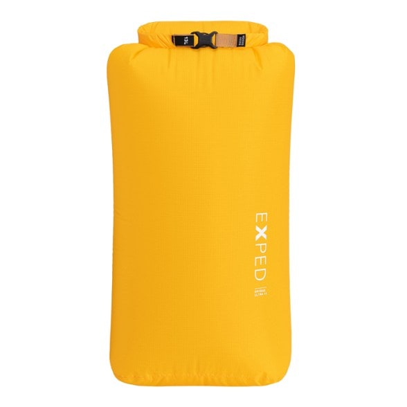 Rolled-down TrekSafe Featherlight ultralight dry bag in bright blue, showcasing its compact, waterproof design on a dark background.