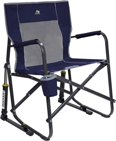 Freestyle Rocker Chair unfolded on grass, showcasing padded armrests and cup holder