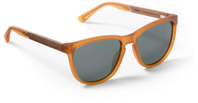 Close-up of Arrowcrest TrailPro sunglasses showing 3-ply wood detail and crystal green polarized lenses.