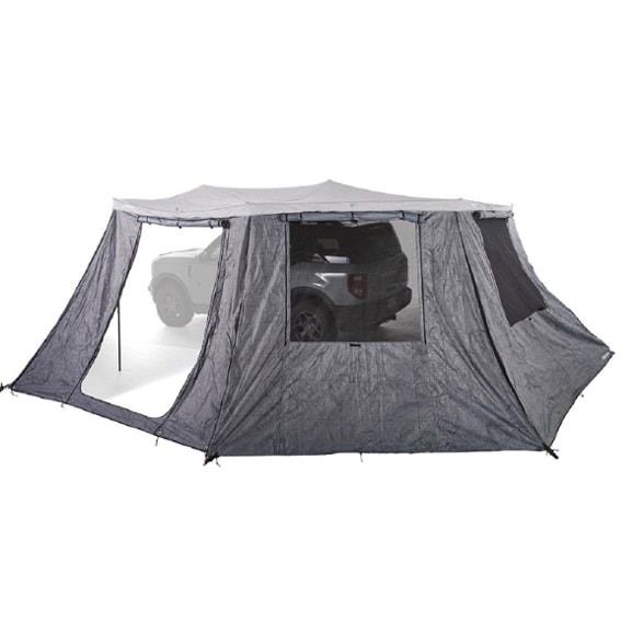 Side view of a Yakima OverNOut 270 XL awning with the full wall kit installed, providing complete enclosure and privacy at a campsite.