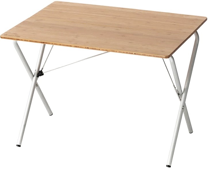 Snow Peak camping table with aluminum legs set up for a picnic in nature.