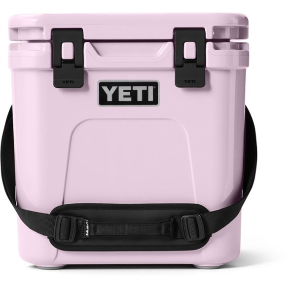 YETI Roadie 24 2.0 cooler opened, showcasing interior storage and Quicklatch™ system