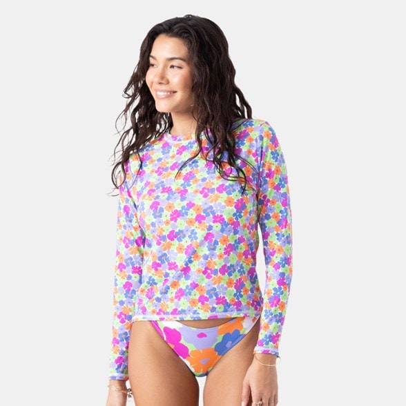 Close-up of SunSkim LyraFlex rashguard showing recycled fabric texture and crew neckline